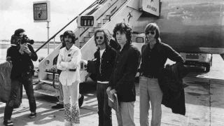 The Doors disembarking from a plane in London in 1968