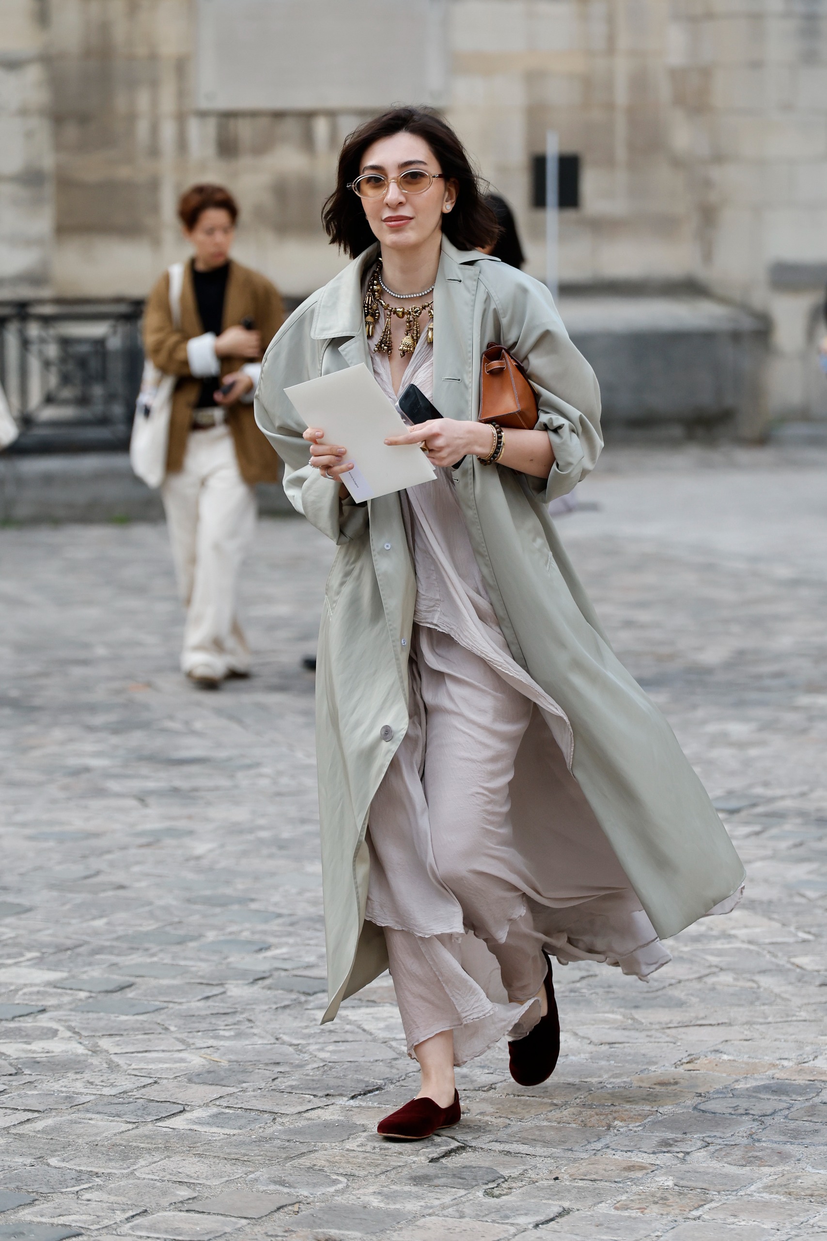 French girls wearing trench coats for fall at Paris Fashion Week