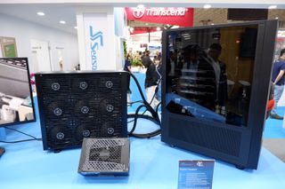 A huge panel radiator outside the case of a AI PC at the Seasonic booth, Computex 2024