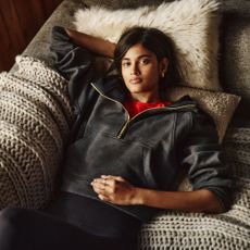 Model lying on a sofa wearing lululemon loungewear