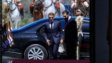 President Emmanuel Macron (L) and Syria's President Ahmed al-Sharaa arrive ahead of their meeting at the People's Palace in Damascus