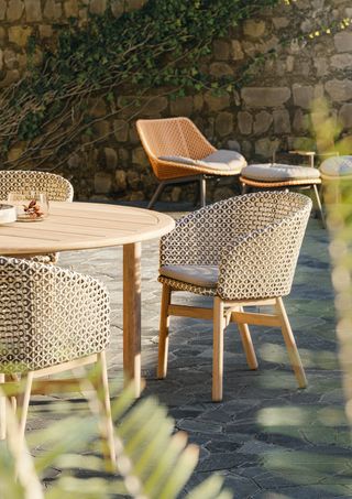 Dedon Mbrace outdoor chairs around table