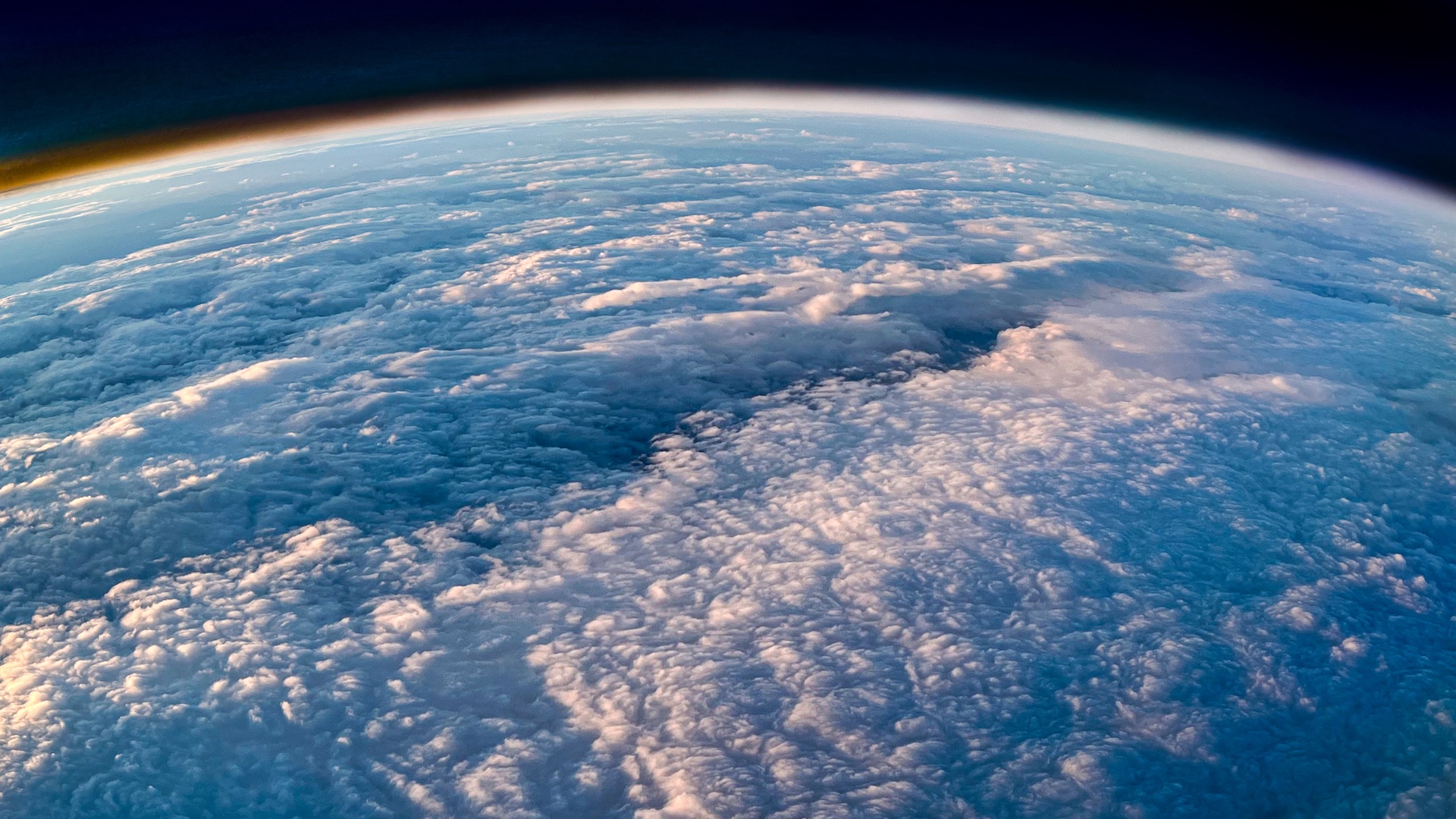 A photo of Earth from space showing its upper atmosphere