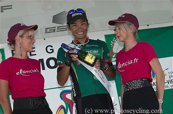 Arashiro shows off his bottle of champagne.