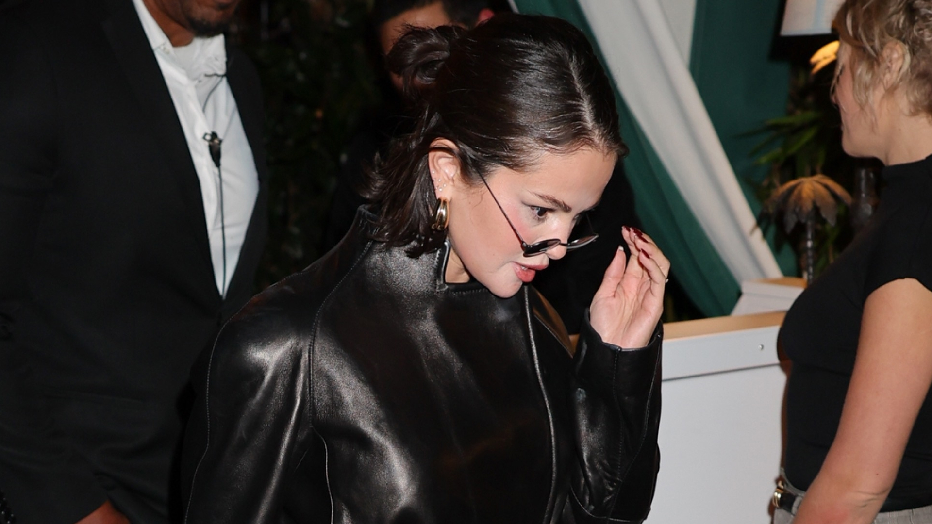 Selena Gomez leaving Brooks Nader's birthday dinner at San Vicente Bungalows in West Hollywood, California on February 7 wearing a Khaite leather jacket and carrying a Prada leather bag