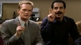 Neil Patrick Harris and Tony Shalhoub each holding up an index finger on Stark Raving Mad