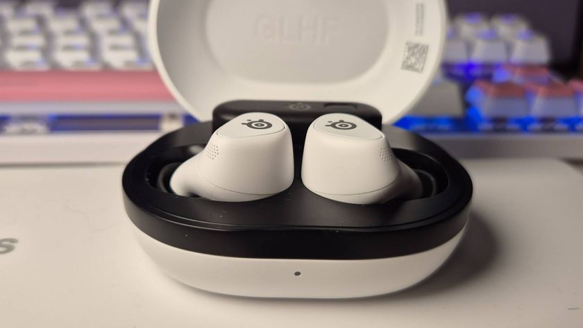 Photo of the SteelSeries Arctis Game Buds on a white desk, taken by writer Rosalie Newcombe.