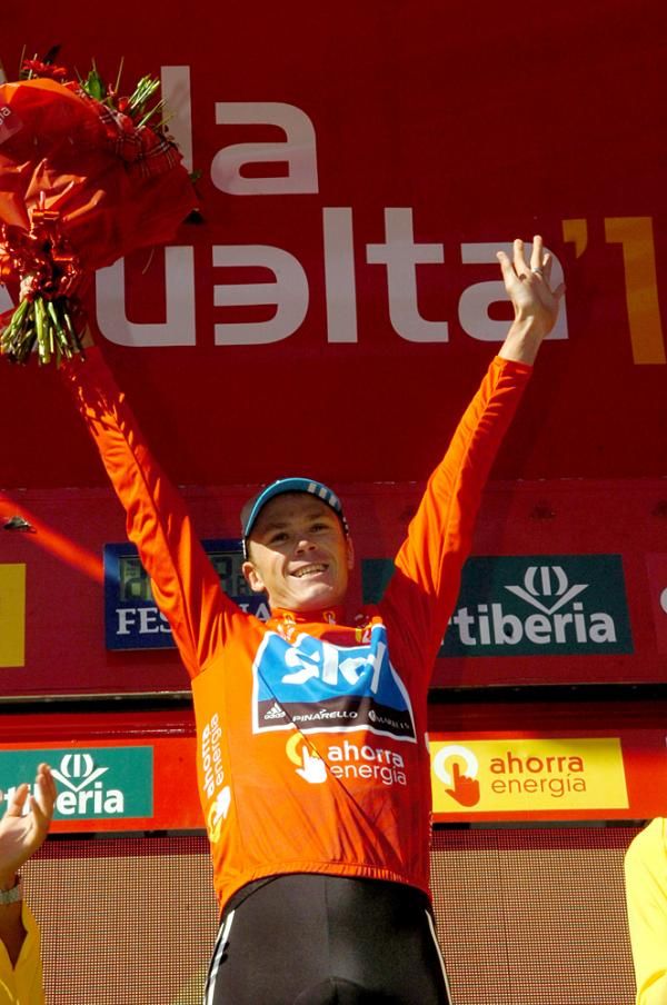 Chris Froome celebrates his first Grand Tour jersey
