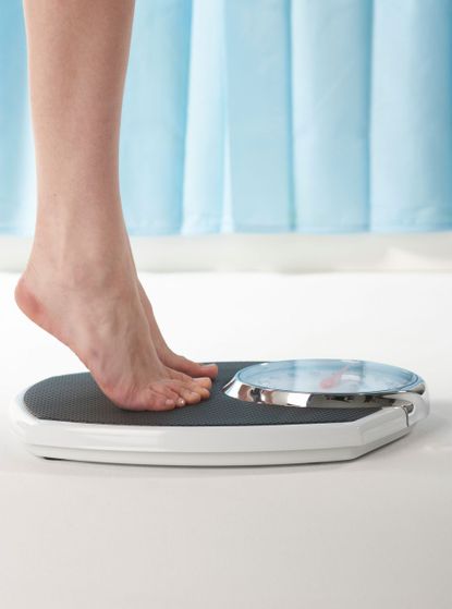 Woman on scales photo