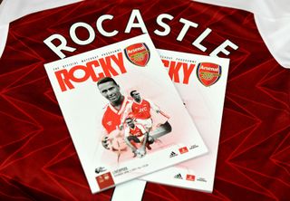 The Arsenal matchday programme dedicated to ex player David Rocastle in the changing room before the Premier League match between Arsenal and Liverpool at Emirates Stadium on April 03, 2021 in London, England. The Arsenal matchday programme dedicated to ex player David Rocastle in the changing room before the Premier League match between Arsenal and Liverpool at Emirates Stadium on April 03, 2021 in London, England.