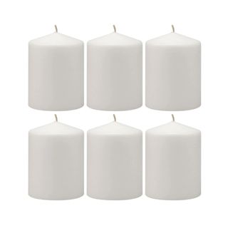 six white pillar candles