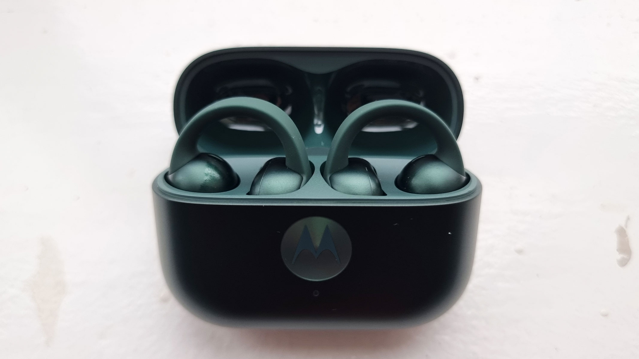 A close-up picture of our reviewer's Motorola Moto Buds Loop earbuds