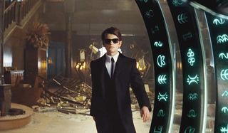 Artemis Fowl walking away from a wrecked room