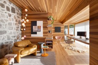 the living room of a cabin home office space