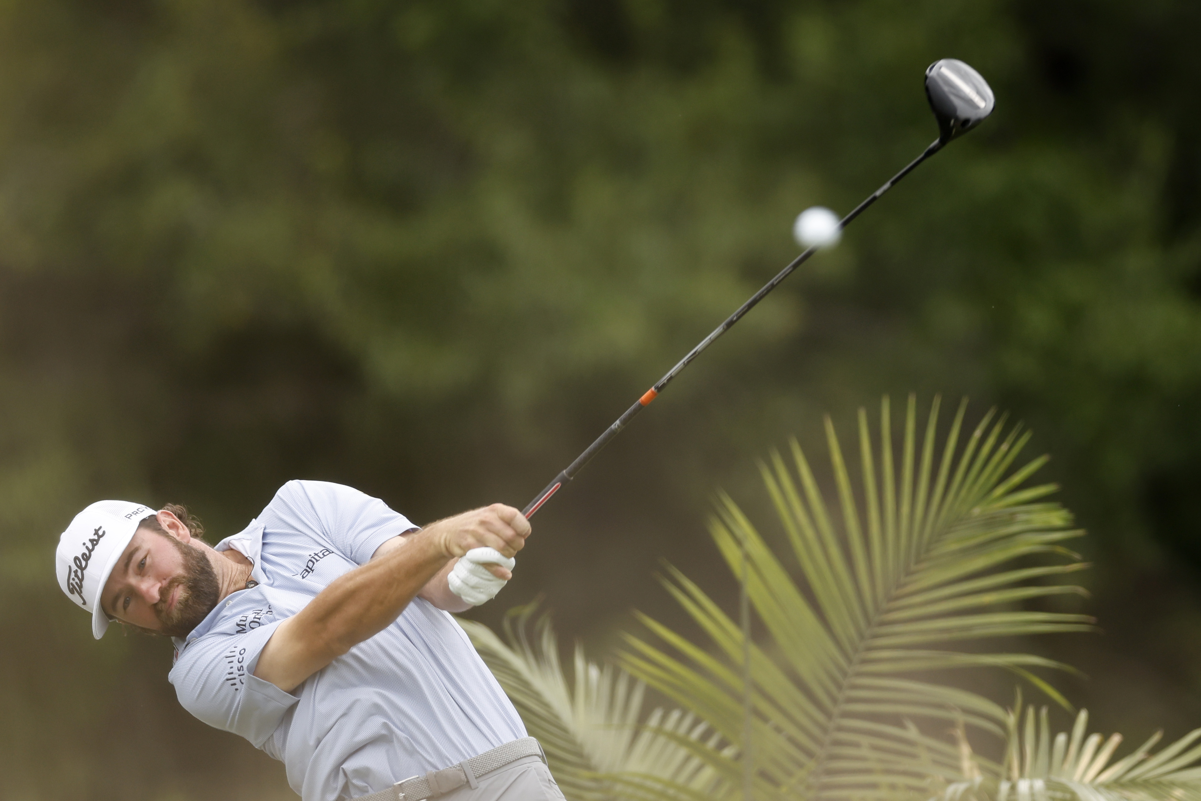 Cameron Young hits a driver off the tee