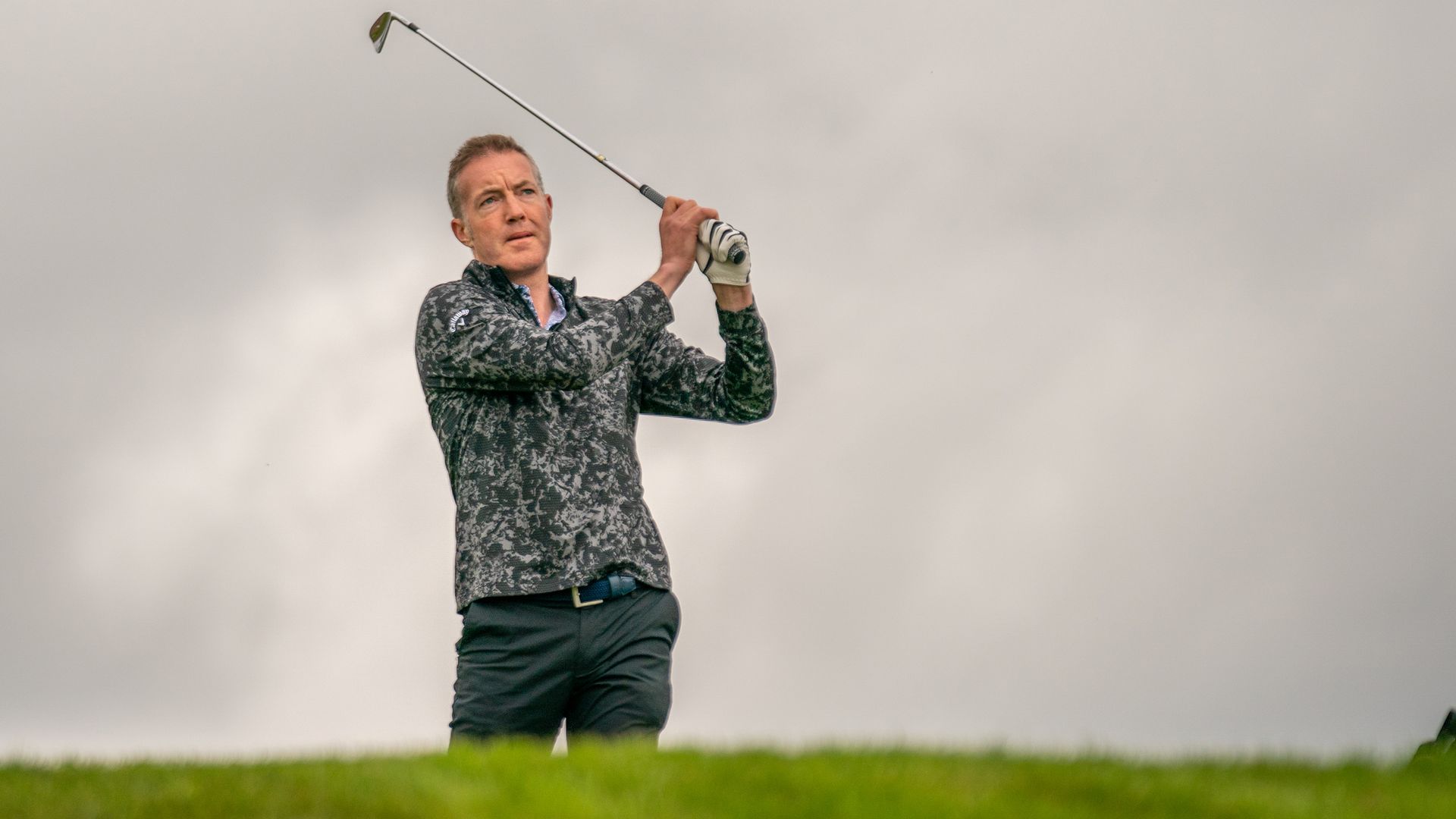 A golfer hitting an iron shot at Gleneagles