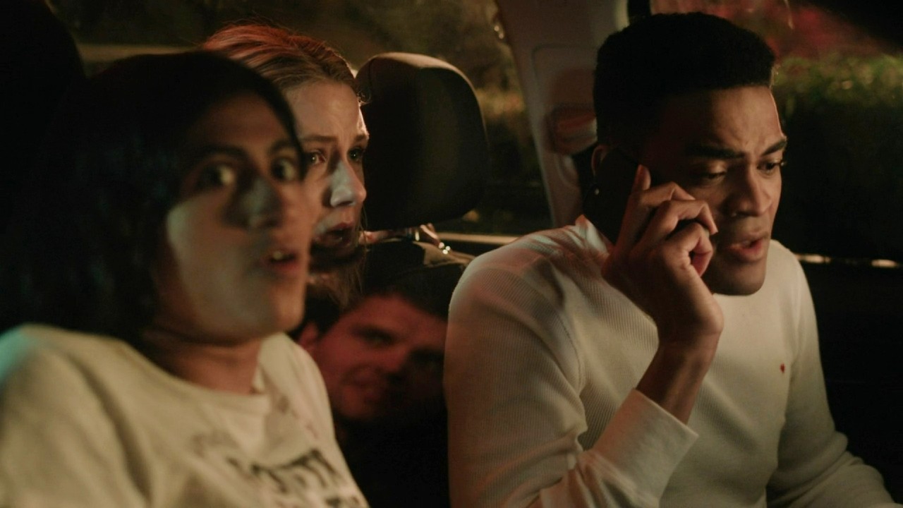 Ray Nicholson scaring Amita Rao, Owen Thiele, and Lucy Freyer in Adults.