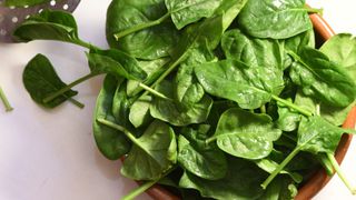 Bowl of loose leaf spinach, fresh