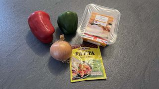 Fajita ingredients - chicken, onion, red and green peppers, and spice mix