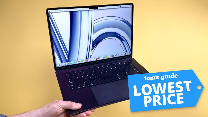 MacBook Air M3 15-inch in hand with Tom&#039;s Guide Lowest Price badge