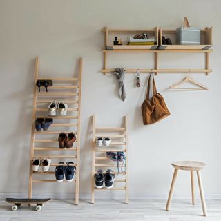 wood finish ladders used as show storage ideas