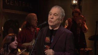 Paul Simon performing on SNL