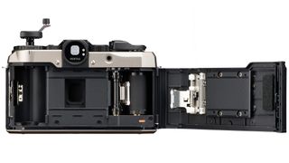 The back inside of the new Pentax 17 film camera showing where the film cartridge is loaded in.
