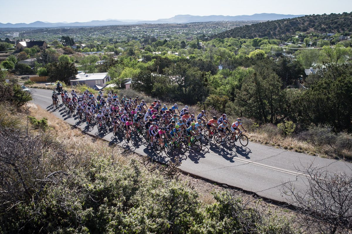 The women's peloton leaves downtown Silver City