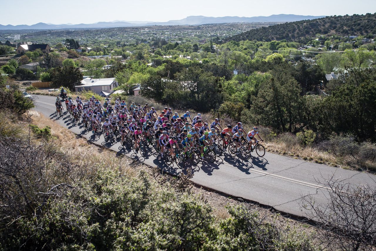 The women's peloton leaves downtown Silver City