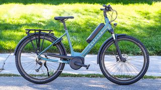 Gazelle Medeo T9 City e-bike parked next to a sidewalk and grass