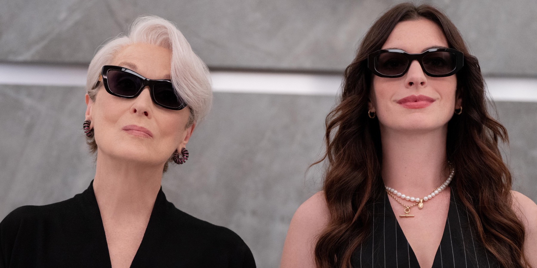 Meryl Streep as Miranda Priestly and Anne Hathaway as Andrea Sachs