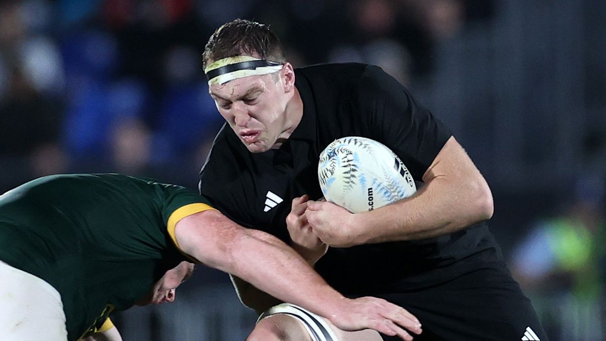 Brodie Retallick of the All Blacks (R) fends during The Rugby Championship match between the New Zealand All Blacks and South Africa Springbok