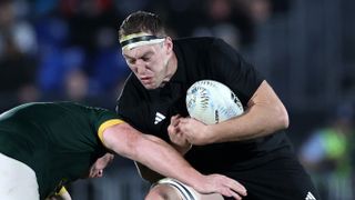 Brodie Retallick of the All Blacks (R) fends during The Rugby Championship match between the New Zealand All Blacks and South Africa Springbok