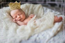 Sleeping baby wearing a crown