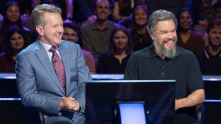 Ken Jennings and Matt Damon smiling on Who Wants to Be a Millionaire. 
