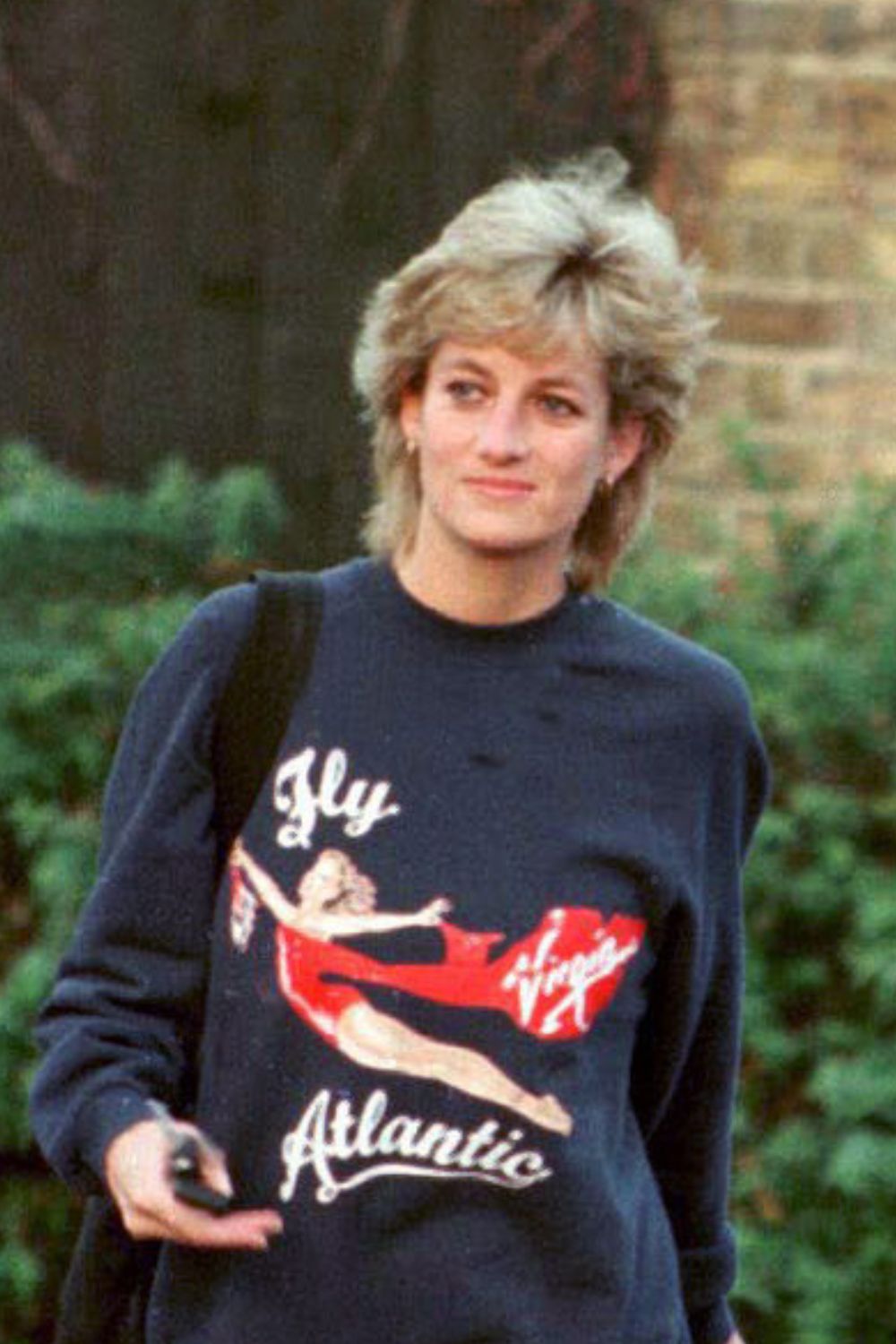Princess Diana Hair - Princess Diana, Princess of Wales, wearing Virgin Atlantic sweatshirt, leaves Chelsea Harbour Club - GettyImages 76214568