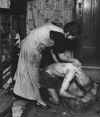 "Coal-Miner’s Bath, Chester-le-Street, Durham, 1937", by Bill Brandt 