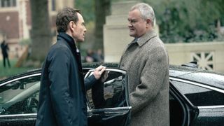 L-R: Michael Fassbender as Martian and Hugh Bonneville as Richardson in "The Agency," episode 10, season 1, streaming on Paramount Plus with Showtime.