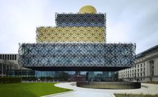 New Birmingham library design in black and yellow with metal circular shapes surrounding the outside of the building