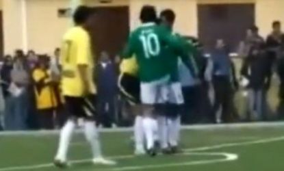 Bolivian President Evo Morales knees an opponent in the groin during a friendly game of soccer.