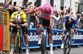 VICENZA ITALY MAY 23 LR Second place winner Wout Van Aert of Belgium and Team Visma Lease a Bike and the third place winner Isaac Del Toro of Mexico and Team UAE Team Emirates XRG Pink Leader Jersey react after the 108th Giro dItalia 2025 Stage 13 a 180km stage from Rovigo to Vicenza UCIWT on May 23 2025 in Vicenza Italy Photo by Tim de WaeleGetty Images