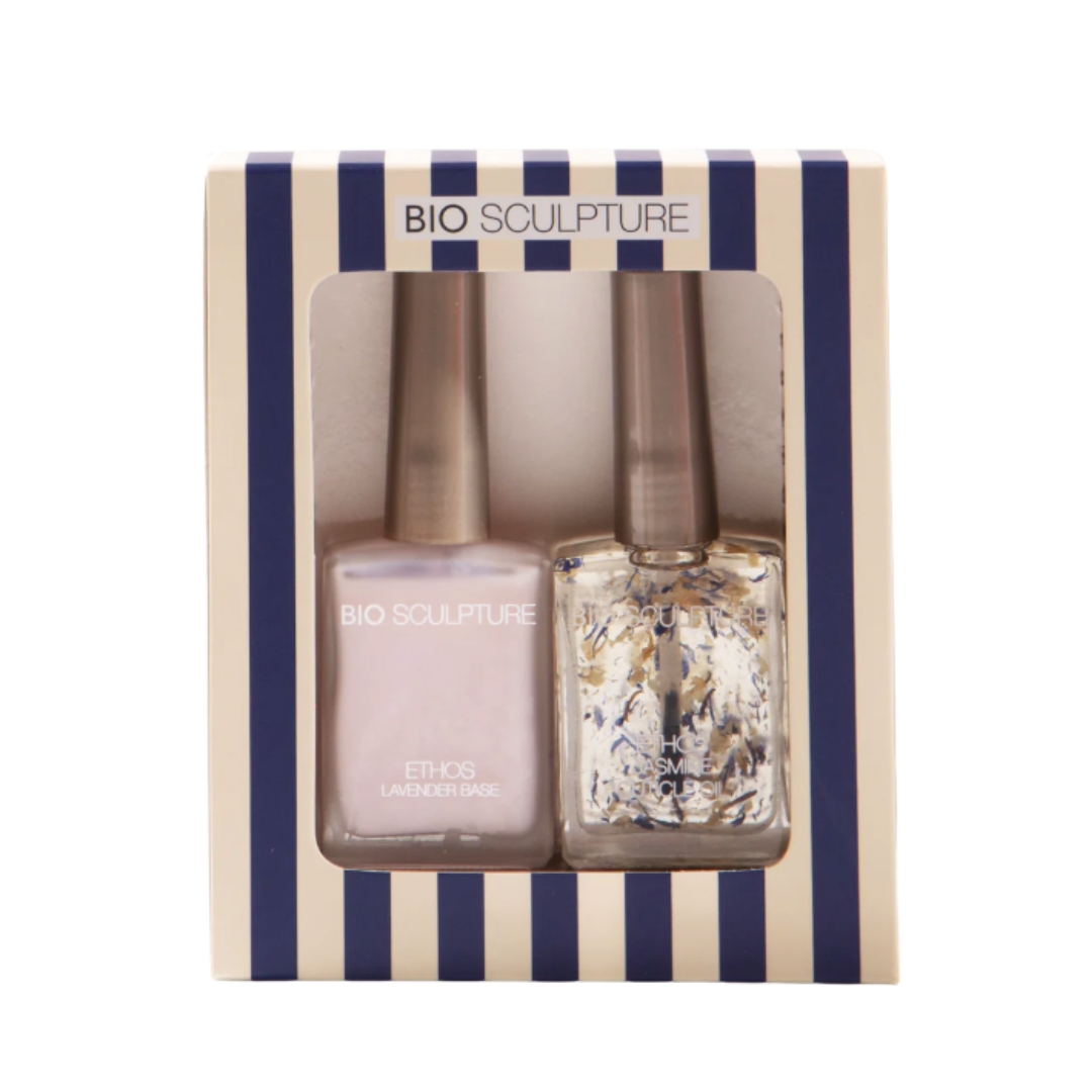 A product shot of the Bio Sculpture Glow Getter - Christmas Treatment Gift Set, which features a Jasmine cuticle oil and the Ethos Lavender Base polish, on a white background