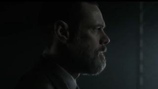 Jim Carrey staring intensely into darkness in Dark Crimes