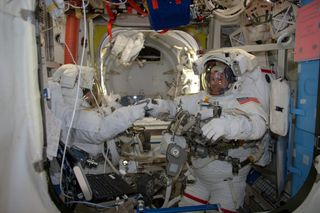 NASA astronauts Shane Kimbrough and Peggy Whitson, clad in their spacesuits, are ready for the first spacewalk of their Expedition 50 mission at the International Space Station on Jan. 6, 2017. European Space Agency astronaut Thomas Pesquet snapped this p
