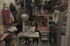 A Hong Kong family in their 120-square-foot home.