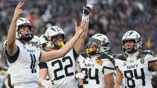 Midshipmen quarterback Blake Horvath celebrates scoring a touchdown in the 2024 Army vs Navy game
