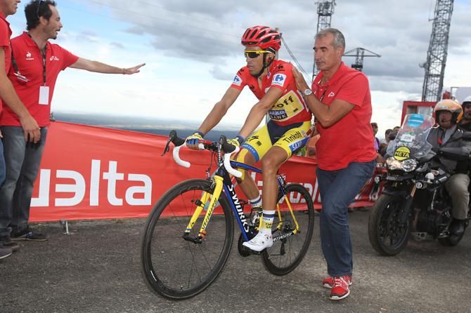 Alberto Contador (Tinkoff-Saxo) gets a little support after crossing the finish line