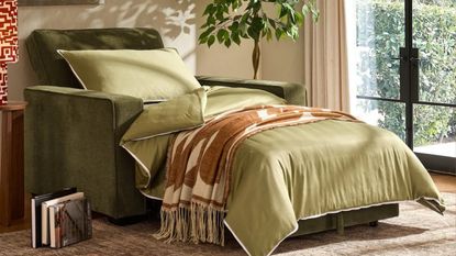 a sofa chair in green velvet with green bedding