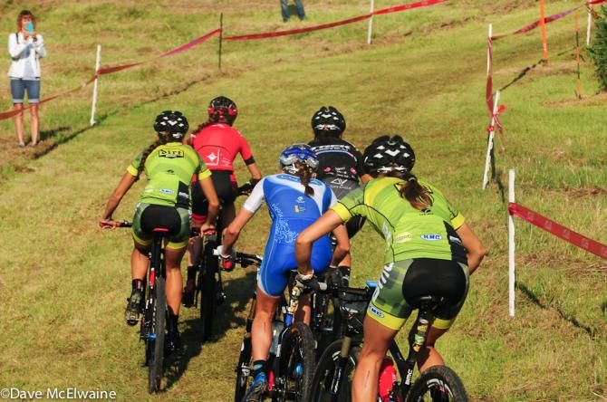 Kate Courtney (Specialized) leads the women onto the course