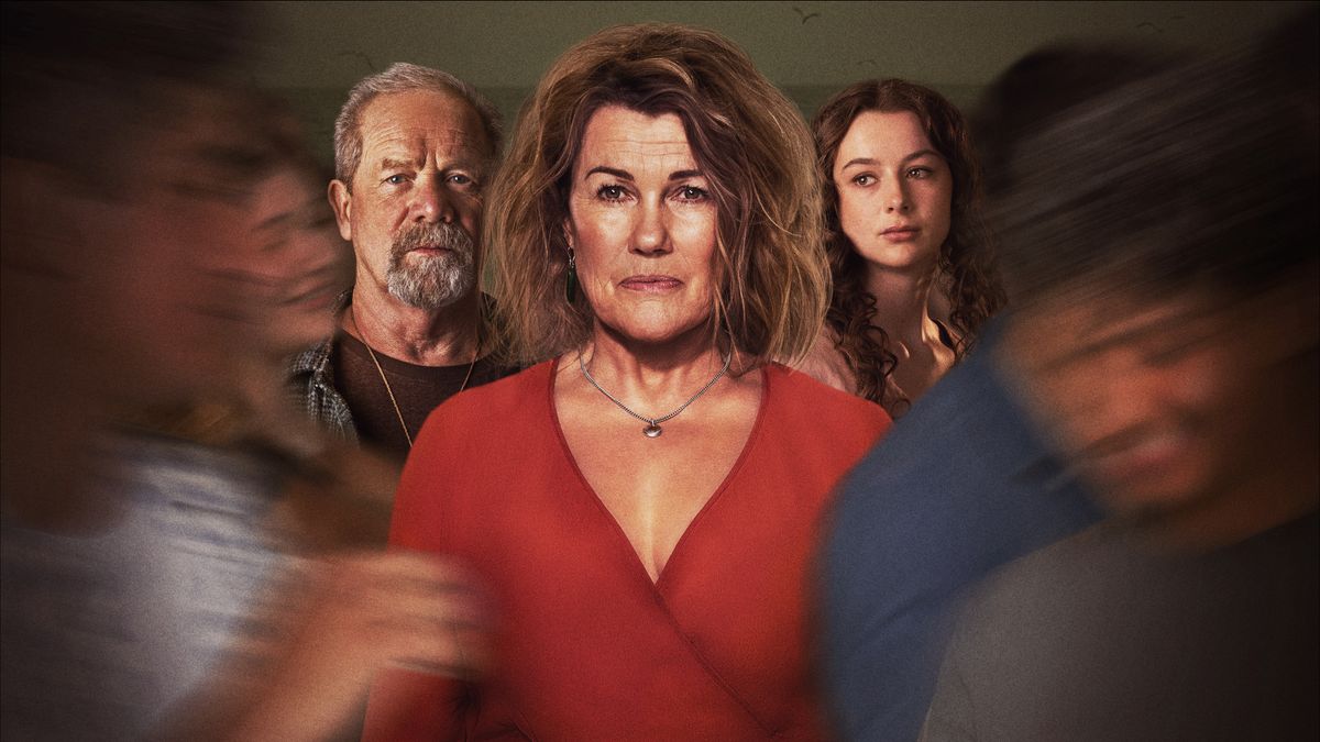 Robyn Malcolm in red dress as Penny is surrounded by blurry figures at a party, while Peter Mullan as Phil as Tara Canton as Grace stand either side of her in After The Party